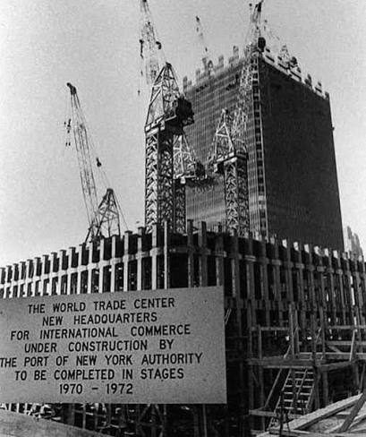 The Twin Towers rising above Lower Manhattan during construction